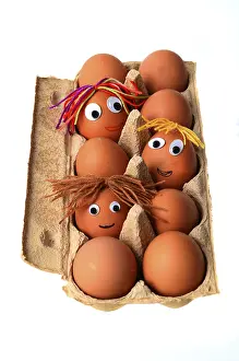 Funny Food Photography Prints: Eggs with faces in an egg box