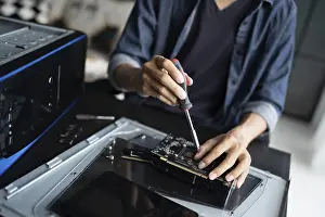 Images Dated 27th August 2024: IT Engineer Installing Hardware Print