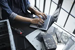 Images Dated 27th August 2024: IT Engineer Installing Hardware Equipment Print