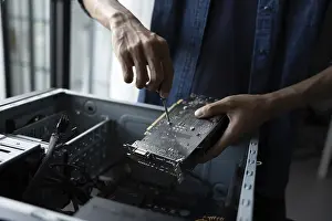 Images Dated 27th August 2024: IT Engineer Installing Hardware Equipment Print