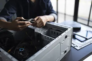 Images Dated 27th August 2024: IT Engineer Installing Motherboard Print