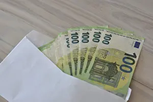 Office Supplies Stationery Prints: Many one hundred euro notes in an envelope on a table