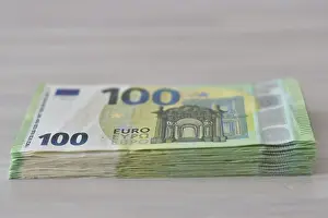 Paper Money Transaction Prints: Many one hundred euro notes in a pile on a table