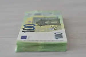 Paper Money Finance Prints: Many one hundred euro notes in a pile on a table