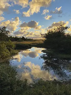 Cloudy Sky Reflection Prints: Evening clouds reflected in a small lake