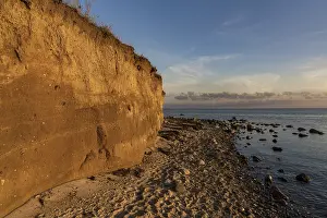 Atmospheric Evening Light In Europe Prints: Evening light over the beach and cliffs in Klein Zicker