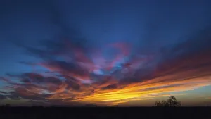 Backlit Photo Prints: Evening sky with clouds at sunset