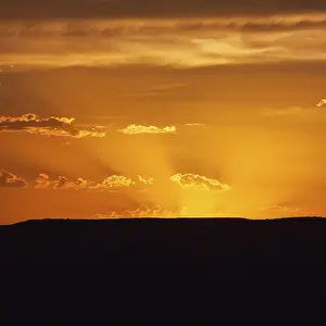 Evening Desert Atmosphere Prints: Evening sky with sun rays over Table Mountain