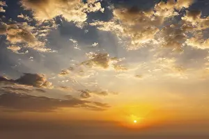 Evening Landscape Photography Prints: Evening sunset sky with sun and dramatic clouds