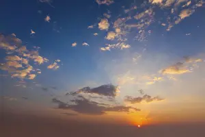 Dusk Landscape Photography Prints: Evening sunset sky with sun and dramatic clouds
