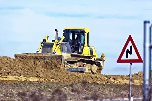 European Construction Site Prints: An excavator on a construction site during construction work