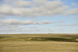 Cloudscape Photography Prints: Expansive rolling fields under a partly cloudy sky