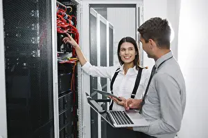 Digital Currency Exchange Prints: IT expert checking supercomputer server