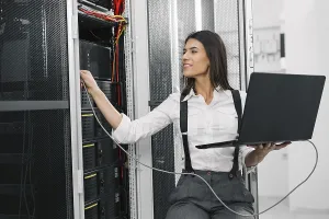 Cybercrime Prevention Prints: IT expert checking supercomputer server