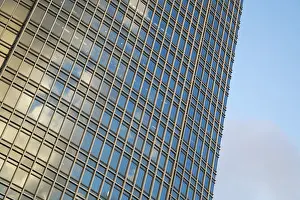 Urban Building Facade Prints: Facade of the skyscraper with windows over blue sky