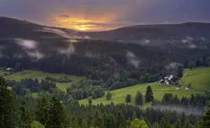 Stormy Weather In Europe Prints: Some farms, surrounded by meadows and forest