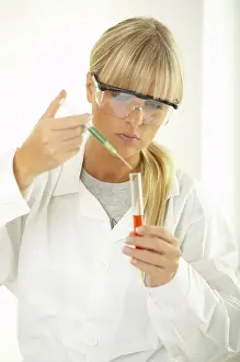 Laboratory Equipment Use Prints: Female lab worker testing and experimenting