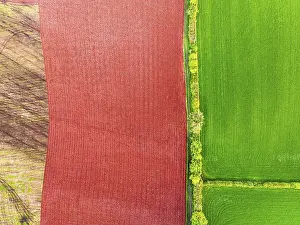 High Angle Aerial Shot Prints: Top Down over Fields and farms from a drone