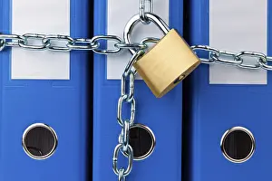 Data Protection Austria Prints: A file folder locked with a chain and padlock