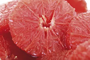 Studio Shot Of Grapes Prints: Filet slices of ruby red grape fruit