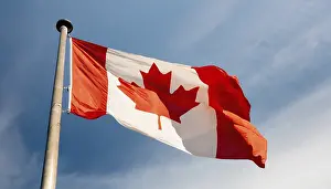Travel Photography Canada Prints: The flag of Canada flutters in the wind