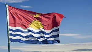 Prints of The flag of Kiribati, Polynesia, flutters in the wind, isolated against a blue sky Kiribati Prints: The Flag of Kiribati Print: A Blue Sky Background