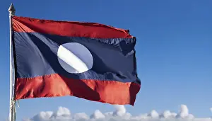 Blue Sky With Flag Prints: The flag of Laos flutters in the wind