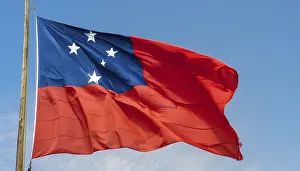 Blue Sky Image Prints: The flag of Samoa, fluttering in the wind