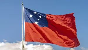 Blue Sky With Fluttering Flag Prints: The flag of Samoa, fluttering in the wind