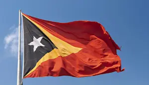 Blue Sky Flags Prints: The flag of Timor, fluttering in the wind