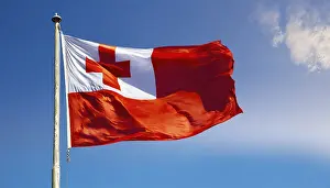 Prints of The flag of Tonga, fluttering in the wind, isolated, against the blue sky Tonga Prints: The Flag of Tonga Print: Isolated Blue Sky Scene
