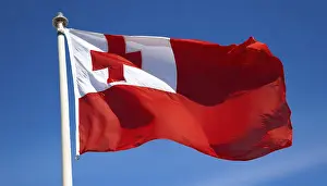 Prints of The flag of Tonga, fluttering in the wind, isolated, against the blue sky Tonga Prints: The Flag of Tonga Print, Isolated Against Blue Sky