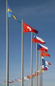 Blue Sky Flags Prints: Flags of different countries against the background of blue sky