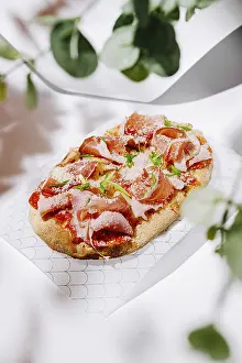 Dairy Products Prints: A flatbread is elegantly prepared with layers of cured meats