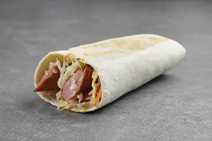 Grocery Store Food Images Prints: Flatbread rolled with with thin sausage