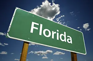Overcast Sky Photo Prints: Florida road sign with dramatic clouds and sky