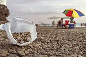 Climate Change Impact Prints: Focus on cigarettes in foreground