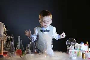 Educational Institution Image Prints: Focused little experimenter posing in studio