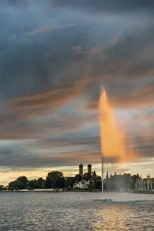 Friedrichshafen Waterfront Scene Prints: Fountain and thunderclouds at sunset
