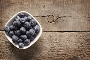 Healthy Eating Habits Prints: Fresh blueberries on an old rustic table, top view