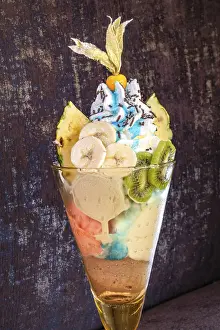 Brown Background Prints: Fruit sundae on brown background