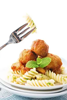 Italian Meal Ideas Prints: Fusilli on fork, meatball fusilli as background