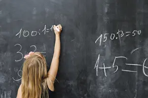 Educational Institution Setting Prints: Girl solving math exercise