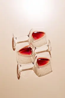 Red Wine Glasses Prints: Three glasses of red wine placed on a flat surface