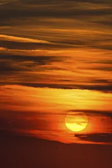 Atmospheric Evening Shot Prints: Glowing sun, sunset with clouds