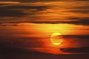 Evening Sun Germany Prints: Glowing sun, sunset with clouds