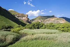 Uninhabited Sandstone Rock Formations Prints: Grassland with sandstone cliffs and cliffs