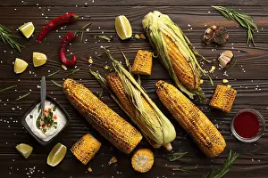 Flat Lay Food Photography Prints: Grilled corn on the cob on kitchen table flat lay background