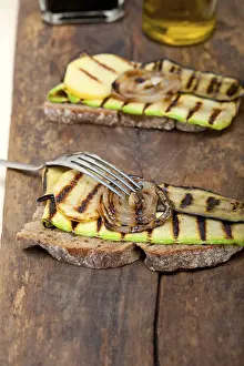 Grilled Vegetables Prints: Grilled vegetables on rustic bread over wood table