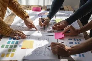 Ux Design Brainstorming Prints: Group of ux developer and ui designer brainstorming about app interface design at modern office